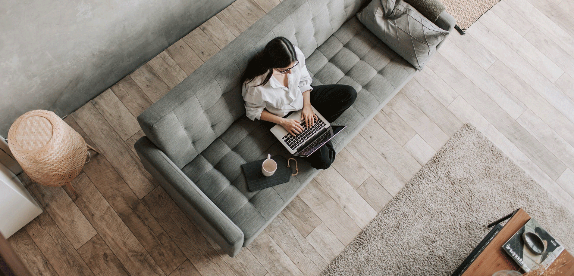 Person working on laptop on couch
